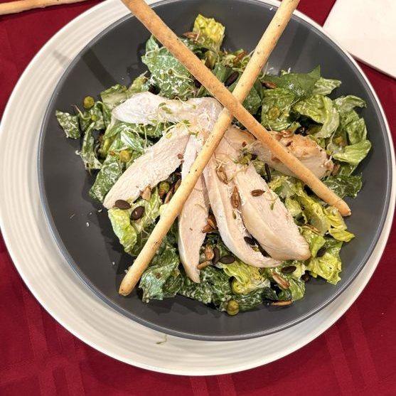 Chicken Caesar salad with grissini