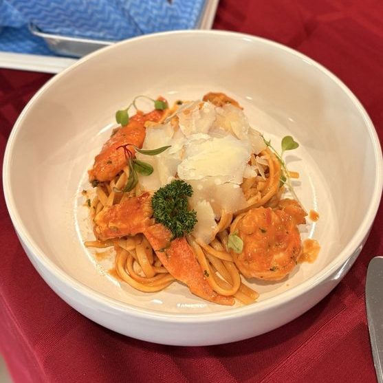 Seafood linguine in a white bowl